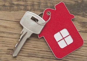 pic of a key with a red house fob attached